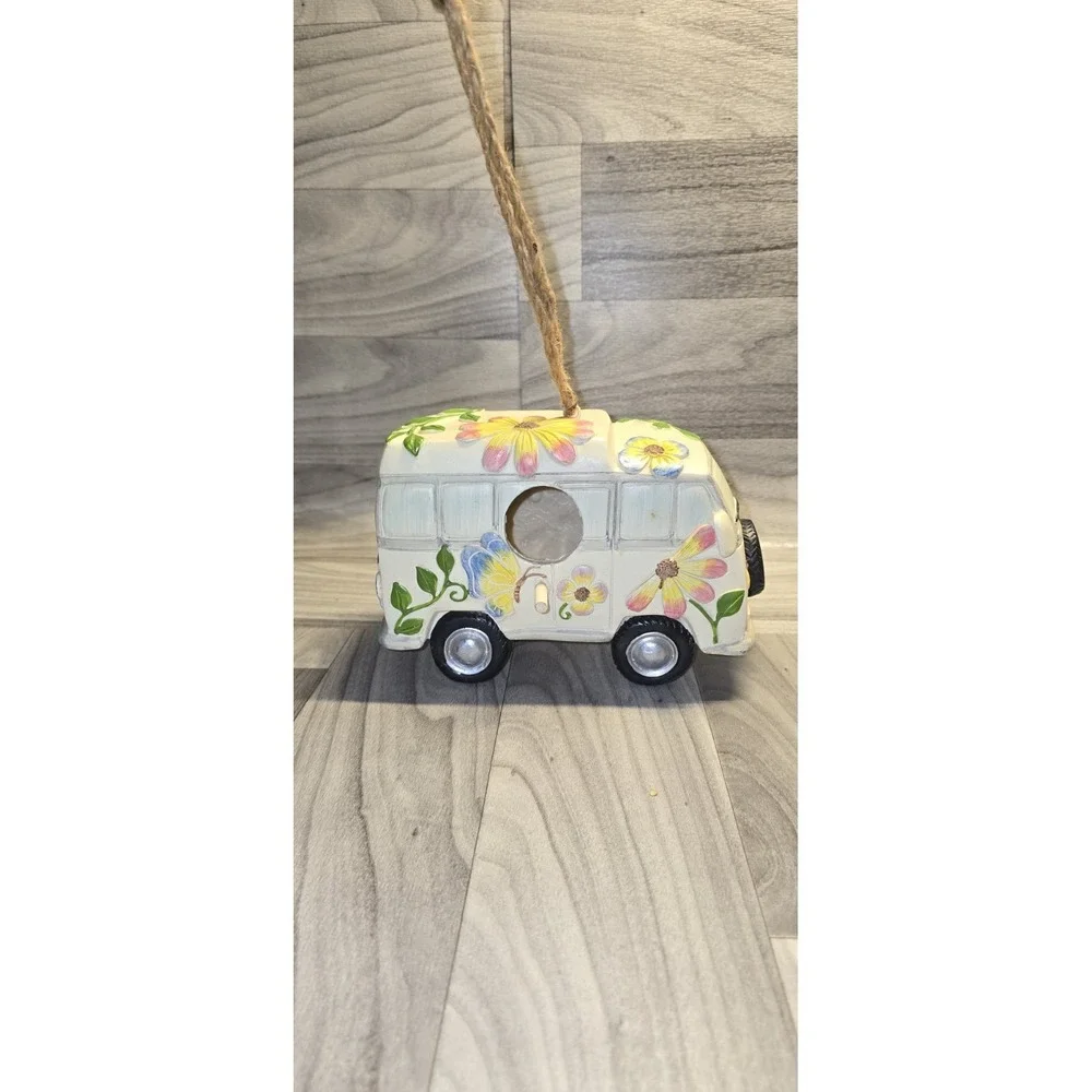 decorative birdhouse styled like a vintage camper van